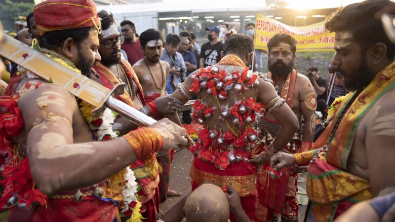 A Hindu devotee is embedded hooks into his back before taking part in a procession during the Thaipusam festival at Batu Caves, outskirts of Kuala Lumpur, Saturday, Feb. 8, 2020. Thaipusam, which is celebrated in honor of Hindu god Lord Murugan, is an annual procession by Hindu devotees seeking blessings, fulfilling vows and offering thanks. AP Photo/RSS
