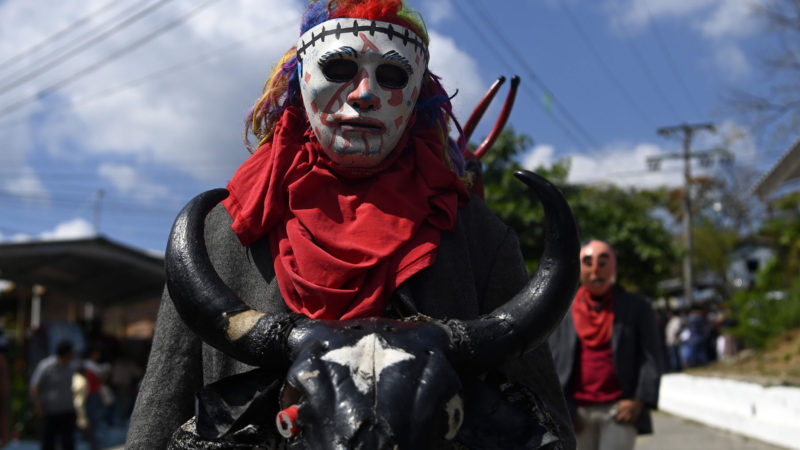 A man wearing a costume takes part in the pilgrimage of the 'Jesusito' child and the 'Zarco' Child, on a 30 km journey from San Ramon, in San Pedro Nonualco, El Salvador on February 4, 2020. Photo / AFP