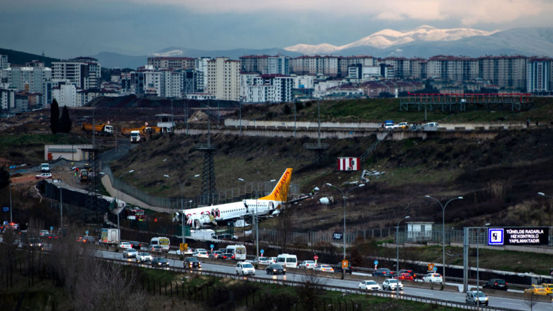 This picture shows the traffic on a highway near the crash site of the Pegasus Airlines Boeing 737 airplane that skidded off the runway upon landing at the Sabiha Gokcen airport, in Istanbul, on February 7, 2020.