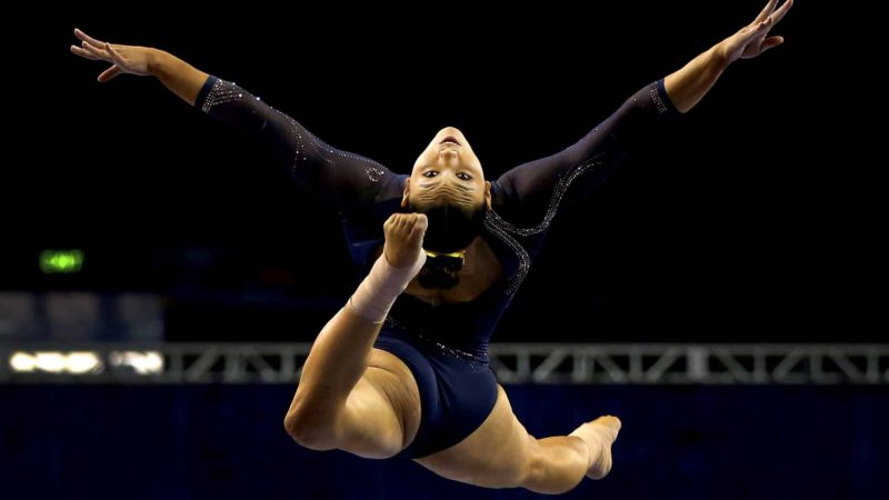 LOS ANGELES, CALIFORNIA - FEBRUARY 23: Kyla Ross of the UCLA Bruins competes on beam during a meet against the Utah Utes at Pauley Pavilion on February 23, 2020 in Los Angeles, California.   Katharine Lotze/Getty Images/AFP  == FOR NEWSPAPERS, INTERNET, TELCOS & TELEVISION USE ONLY ==