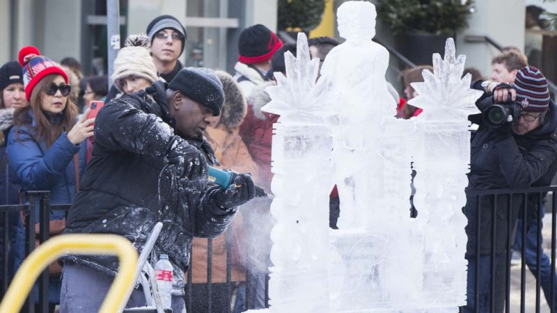 A sculptor works on his ice sculpture during the 2020 Bloor-Yorkville Icefest in Toronto, Canada, on Feb. 8, 2020. Featuring dozens of magnificent ice sculptures with the theme of "Awesome 80's", the two-day annual festival kicked off here on Saturday. Photo/RSS