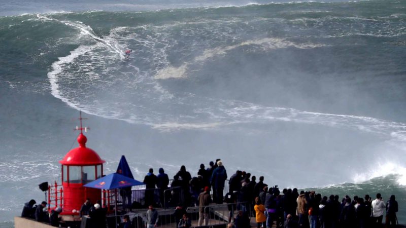 (200212) -- NAZARE, Feb. 12, 2020 (Xinhua) -- Andrew Cotton of Britain competes during the Nazare Tow Surfing Challenge at Praia do Norte in Nazare, Portugal on Feb. 11, 2020. (Photo by Pedro Fiuza/Xinhua)