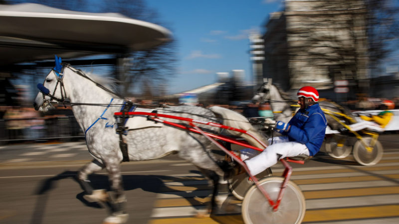 Riders compete during a street harness race in Moscow, Russia, on Feb. 22, 2020. A street harness race was held here on Saturday, which was one lap sprint on the improvised street track. Photo/RSS