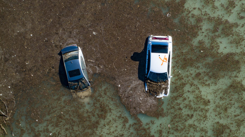 In this aerial photo, water is slowly draining from the freeway after a water main break east of the location flooded all lanes, closing the freeway in both directions, Thursday, Feb. 27, 2020, at the intersection of 610 and Clinton Drive in east Houston. Businesses and schools shut down Thursday after a main line from a plant that supplies water to about half of Houston burst open, submerging vehicles on the flooded freeway and prompting emergency officials to deploy tanker trucks to mitigate any fire hazards. Photo/RSS