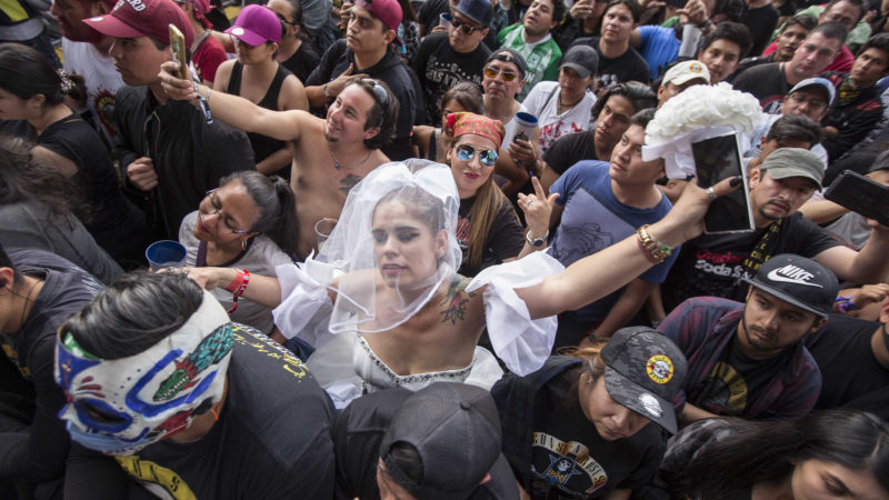 A woman dressed as a bride dances at the Vive Latino festival in Mexico City, Saturday, March 14, 2020. On Friday afternoon organizers confirmed that the 21st edition of the festival will go on as planned.  AP Photo/RSS