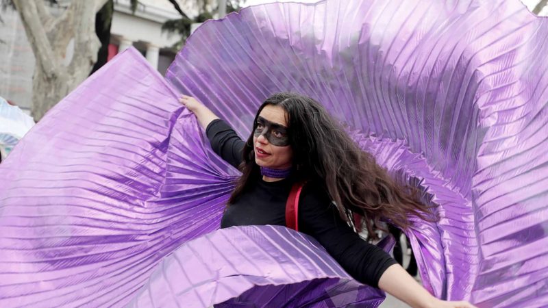 A protester dances during a march on International Women's Day in Madrid, Spain, Sunday, March 8, 2020, Thousands of women are marching in Madrid and other Spanish cities as part of International Women's Day. (AP Photo/Paul White)