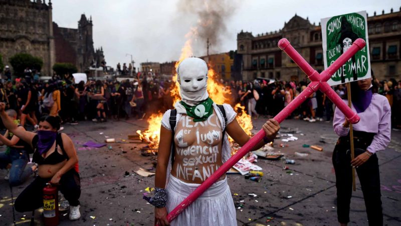 A woman poses for a photo while taking part in a protest during the International Women's Day, in Mexico City, on March 8, 2020. - Women around the globe are taking action to mark International Women's Day and to push for action to obtain equality. (Photo by VICTORIA RAZO / AFP)