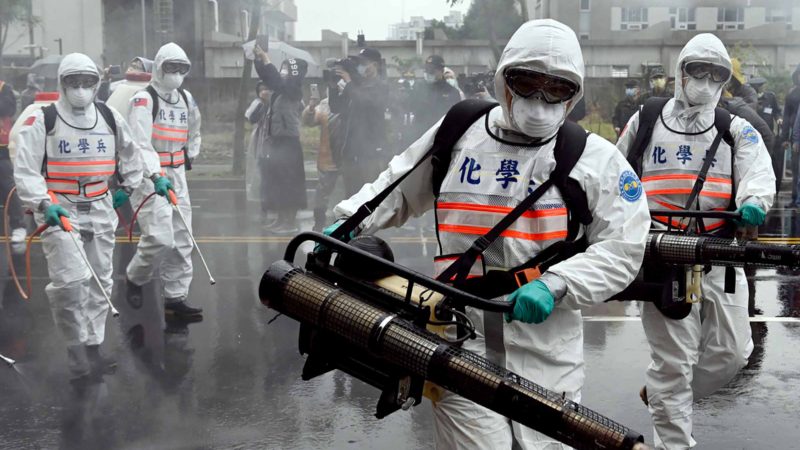 Soldiers from the military’s chemical units take part in a drill organised by the New Taipei City government to prevent the spread of the COVID-19 coronavirus, in Xindian district on March 14, 2020. - Over 450 medical staff, community volunteers, government employees and military personnel took part in the drill. Despite being so close to the original outbreak in mainland China, Taiwan has just 48 confirmed cases of the Covid-19 disease with one death. (Photo by Sam Yeh / AFP)