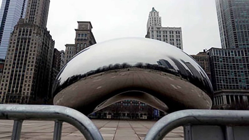 CHICAGO, ILLINOIS - MARCH 19: A barricade surrounds Anish Kapoor's Cloud Gate sculpture (AKA The Bean) in Millennium Park on March 19, 2020 in Chicago, Illinois. The sculpture, one of the city's most visited tourist attractions which invites a hands-on experience, has been closed to the public as the city tries to control the spread of Covid-19.   Scott Olson/Getty Images/AFP  == FOR NEWSPAPERS, INTERNET, TELCOS & TELEVISION USE ONLY ==