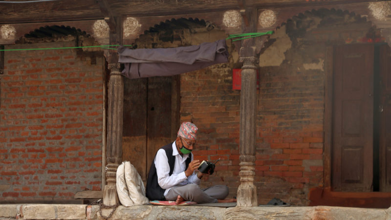 (200420) -- KATHMANDU, April 20, 2020 (Xinhua) -- An elderly man listens to radio during the lockdown amid COVID-19 outbreak in Kathmandu, capital of Nepal, April 20, 2020. The Nepalese government has extended the deadline of the ongoing nationwide lockdown to April 27. (Photo by Sunil Sharma/Xinhua)