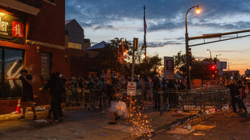Protesters clash with police during a demonstration over the killing of George Floyd by a policeman outside the Third Police Precinct on May 27, 2020 in Minneapolis, Minnesota. - Demonstrators gathered on May 27 for a second night of protests over the killing in the US city of Minneapolis of a handcuffed black man by a policeman who held him to the ground with a knee on his neck. As dusk fell, police formed a human barricade around the Third Precinct, where the officers accused of killing George Floyd worked before they were fired on Tuesday. (Photo/RSS)