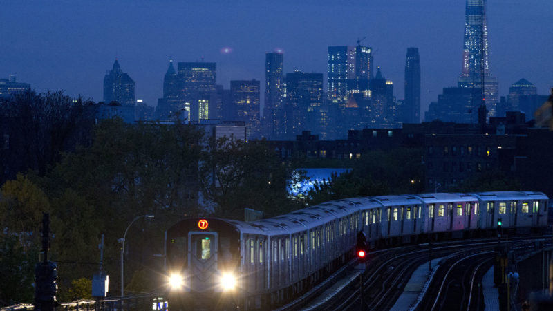 In this May 11, 2016, photo, a No. 7 subway train rides the rails in the Queens borough of New York. Last week, for the first time in New York's history, the trains stopped running in a planned shutdown. Between the hours of 1 a.m. and 5 a.m., the subways and New York's 472 stations began closing for a nightly cleaning to disinfect trains. It's a humbling concession for a swaggering, all-night town that, as much as anything, shows how the coronavirus pandemic has seized the gears of New York, one of the world's hardest hit cities. (AP Photo/Mark Lennihan)