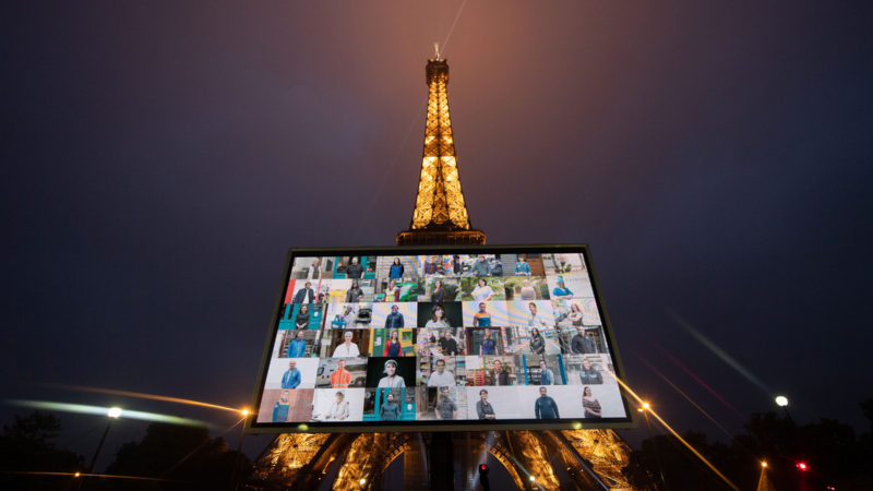 (200511) -- PARIS, May 11, 2020 (Xinhua) -- Portraits of representatives of professional groups who were mobilized during the COVID-19 pandemic are displayed during a tribute on a giant screen in front of the Eiffel Tower in Paris, France, May 10, 2020. (Photo by Jack Chan/Xinhua)