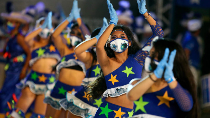 Dancers wear face masks as they perform for a live streaming replacing the traditional Boi-Bumba folklore festival, cancelled amid the new coronavirus pandemic in Parintins, Amazonas state, Brazil, on June 27, 2020. - Parintins is well-known internationally for its Boi-Bumba folklore festival, which lasts for three days in late June and which themes, costumes and songs are based on indigenous cultures of the Amazon rainforest. A live streaming replaced the festival this year to prevent the spread of COVID-19. (Photo/RSS)