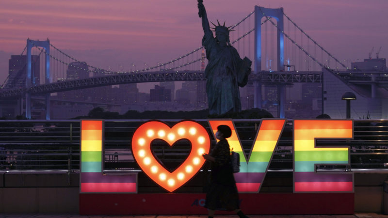 A visitor walks at Odaiba at sunset Wednesday, June 3, 2020, in Tokyo. A coronavirus state of emergency has been lifted, ending the restrictions nationwide as businesses began to reopen.(AP Photo/RSS)