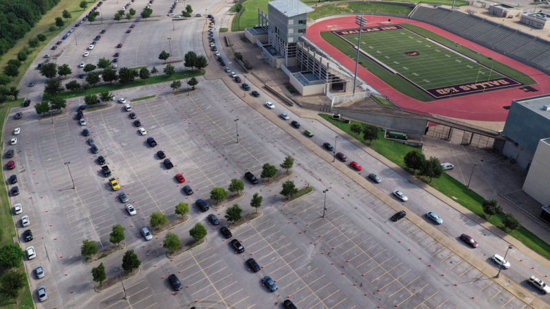 An aerial view from a drone as residents wait in line for the drive-thru COVID-19 testing center at the Ellis Davis Field House on July 2, 2020 in Dallas, Texas. Texas is facing a surge of new cases of COVID-19 after the state government allowed business to open prematurely. Photo/RSS