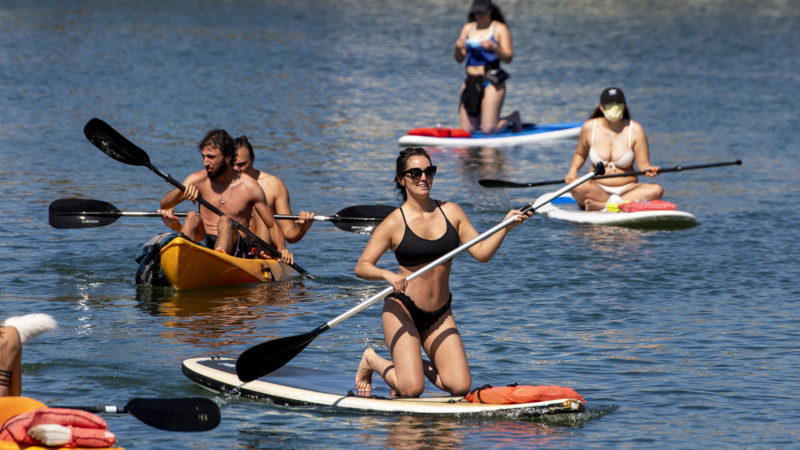 With beaches closed for the Fourth of July holiday weekend, because of the coronavirus pandemic, many took to kayaking and paddle boarding in Huntington Harbour in Huntington Beach, Calif., Sunday, July 5, 2020. Photo/RSS