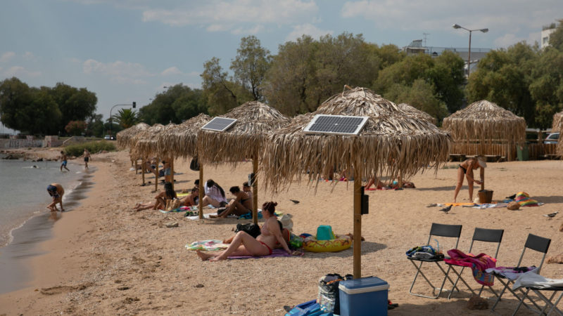 Photo taken on July 21, 2020 shows solar panels on umbrellas at an open public beach near the city hall of Vari-Voula-Vouliagmeni municipality in southern Athens, Greece. Photo/RSS
