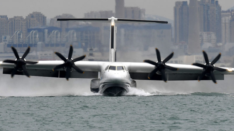 An AG600 "Kunlong" amphibious aircraft slides on the sea off Qingdao, east China's Shandong Province, July 26, 2020.   China's indigenously developed AG600 large amphibious aircraft succeeded in its maiden flight over sea on Sunday morning in Qingdao, east China's Shandong Province, its developer announced.   Photo/RSS