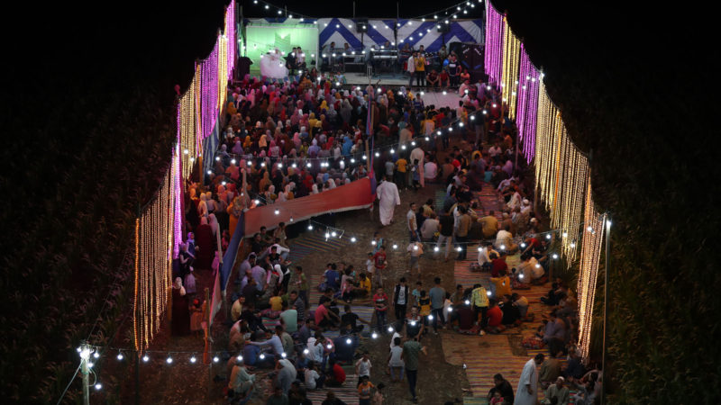 Guests gather between corn fields to attend a traditional wedding celebration in the village of Shamma in Egypt's northern Nile Delta province of Menoufia on August 21, 2020. (Photo/RSS)