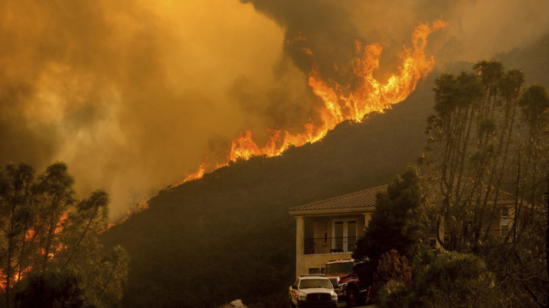 In this Monday, Aug. 17, 2020 file photo, flames from the River Fire crest a ridge in Salinas, Calif. In California, a Mediterranean climate sets up ideal conditions for fire then is worsened by climate change, says University of California, Merced, fire scientist LeRoy Westerling, who has had his home threatened twice in the last few years. (AP Photo/RSS)