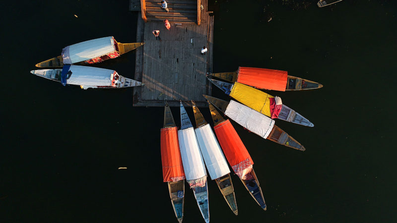 Aerial photo shows boats tied at the banks of Dal Lake in Srinagar, the summer capital of Indian-controlled Kashmir, Sept. 12, 2020. (Photo by Javed Dar/RSS)