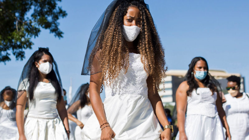 Students from the Autonomous University participate in the tenth edition of the "March of the Brides" in Santo Domingo on October 20, 2020. - The march aims to sensitize the public about the proliferation of domestic and gender violence in the Dominican Republic. (Photo / AFP)