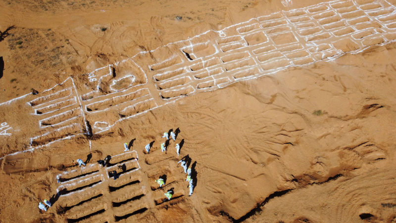 (201028) -- TARHUNA (LIBYA), Oct. 28, 2020 (Xinhua) -- Workers of the General Authority for Research and Identification of Missing Persons in Libya are seen on the site of mass graves in Tarhuna, Libya, on Oct. 28, 2020. A total of 12 unidentified bodies were found in the city of Tarhuna, some 90 km south of capital Tripoli, a local official told Xinhua on Wednesday. The total number of unidentified bodies recovered from Tarhuna since the beginning of the search in June hit 98. (Photo by Hamza Turkia/Xinhua)