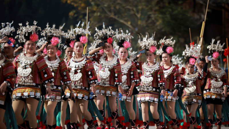 This photo taken on November 18, 2020 shows people of the Miao ethnic minority in traditional costumes parading to celebrate the Miao new year festival in Leishan county, in China's southwestern Guizhou province. (Photo / RSS) /