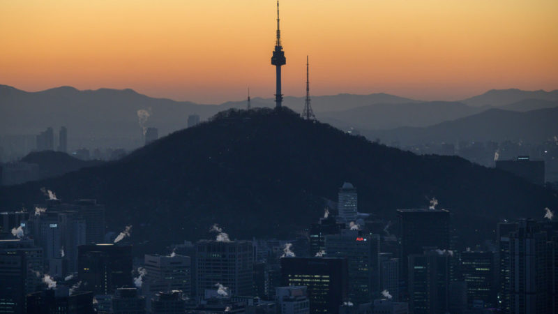 A general view shows the Seoul city skyline and landmark Namsan tower early on December 16, 2020. (Photo by Ed JONES / AFP)