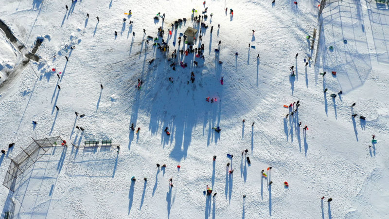 An aerial view of people sledding at Newbridge Road Park on December 17, 2020 in Merrick, New York. Many parts of the Northeast were hit with heavy snowfall in the first big storm of the season.   Images/RSS