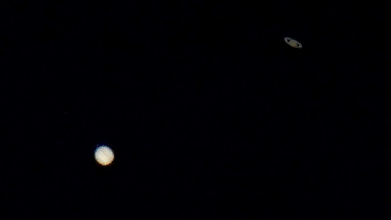 Saturn, top, and Jupiter, below, are seen in the sky, Monday, Dec. 21, 2020, above Edgerton, Kan. The two planets are in their closest observable alignment since 1226. Appearing a tenth of a degree apart, the alignment known as the "great conjunction" has also been called the "Christmas Star." (AP Photo/RSS)