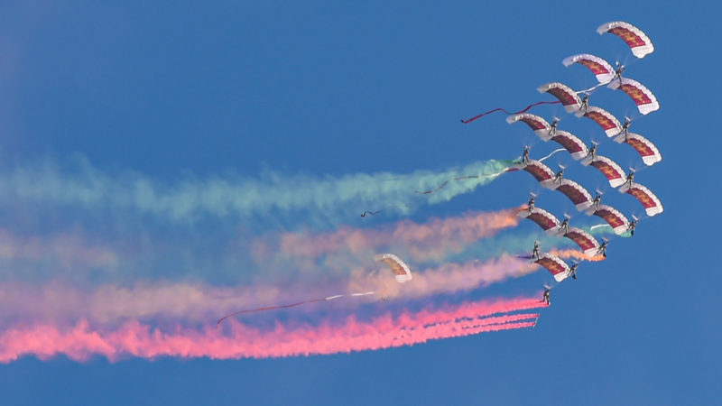 Paragliders fly over the city during a military parade rehearsal for the Qatar's National Day in Doha, capital of Qatar, on Dec. 11, 2020. Qatar will celebrate its National Day on Dec. 18. (Photo/RSS)