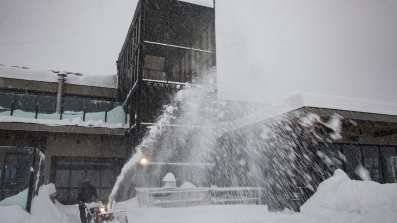 This photo provided by Mammoth Mountain Ski Area, shows a worker clearing heavy snow at Mammoth Mountain Ski Area in Mammoth Lakes, Calif., Thursday, Jan. 28, 2021. In the Eastern Sierra, the Mammoth Mountain ski resort reported 7.25 feet (2.21 meters) of new snow on its summit. A blizzard warning continued for both sides of the California-Nevada border along a 170-mile (274-kilometer) stretch of the Sierra.Phot/RSS