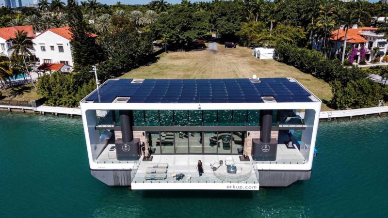 The Arkup luxury floating villa is docked at Star Island in Miami Beach, Florida, on February 5, 2021. - Miami residents are used to seeing this houseboat. It usually docks near the harbor, although it has also appeared in Biscayne Bay. It costs $5.5 million and fits in with the rising sea levels that are sinking Florida. "It looks like a house, but technically it's a boat," says Nicolas Derouin, co-founder and managing director of Arkup, the Miami-based company that created this floating "villa" with a fold-out terrace over the sea. "The first thing we wanted was to address sea level rise and climate change and show new ways of living on the water in a sustainable way," Derouin tells AFP. (Photo by CHANDAN KHANNA / AFP)