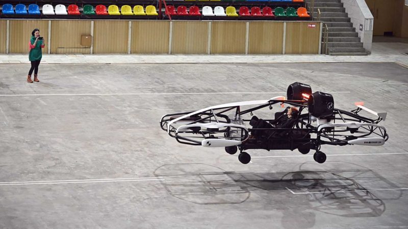 A pilot takes a flight on a flying taxi prototype during testing in Moscow on March 16, 2021. - Russian developer of passenger drones Hoversurf company tests its Hover drone taxi, a flying vehicle that can fly 30 minutes on one charge at an altitude of 150 meters transporting passengers and cargo up to 300 kg for a distance of up to 100 kilometers at speed of 200 kilometers per hour. The company aims to have these drones operating by 2025. (Photo by Alexander NEMENOV / AFP)