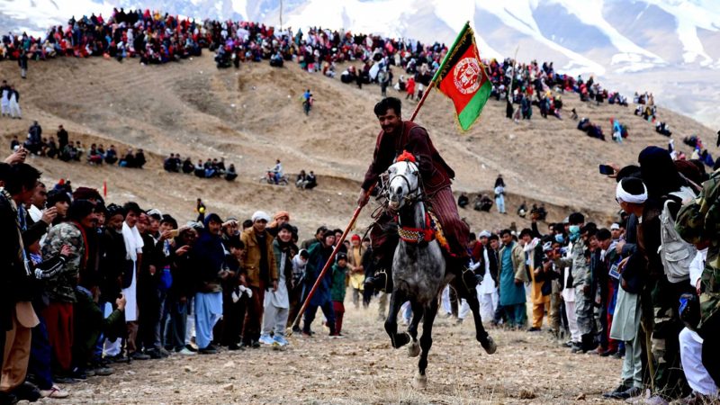 (210321) -- BAMIYAN (AFGHANISTAN), March 21, 2021 (Xinhua) -- A horse rider takes part in a Buzkashi game during a celebration for the annual Nowruz festival in Bamiyan province, central Afghanistan, on March 21, 2021. March 21 is the first day of Nowruz and the start of the year 1400 in Persian calendar. Nowruz is a public holiday in Afghanistan and Afghans celebrate the day by holding conferences, organizing stage shows, exhibitions and airing colorful programs on TV. (Photo by Azimi/Xinhua)