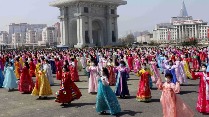 Women dance near the Arch of Triumph on the Day of the Sun, the birth anniversary of late leader Kim Il Sung, in Pyongyang, North Korea, Thursday, April 15, 2021. (AP Photo/Jon Chol Jin)