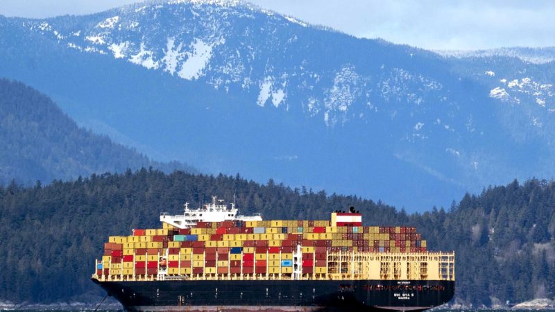 A container ship arrives in Vancouver, British Columbia, Saturday, April 10, 2021. (Jonathan Hayward/The Canadian Press via AP)