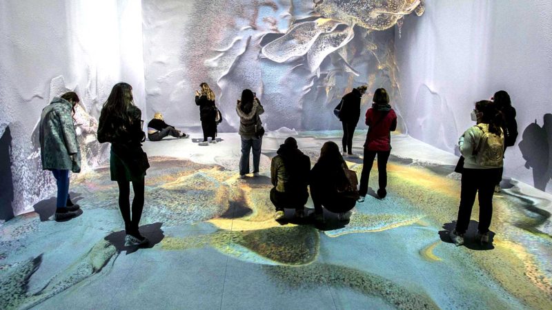 (210402) -- ISTANBUL, April 2, 2021 (Xinhua) -- People visit the contemporary art exhibition "Machine Memories: Space" in Istanbul, Turkey, on April 1, 2021. The exhibition "Machine Memories: Space" created by using artificial intelligence (AI) and images recorded by space telescopes fascinates Istanbul's art lovers, luring thousands of visitors each day despite the COVID-19 pandemic. (Photo by Osman Orsal/Xinhua) TO GO WITH Feature: Contemporary art exhibit heals pandemic wounds in Istanbul