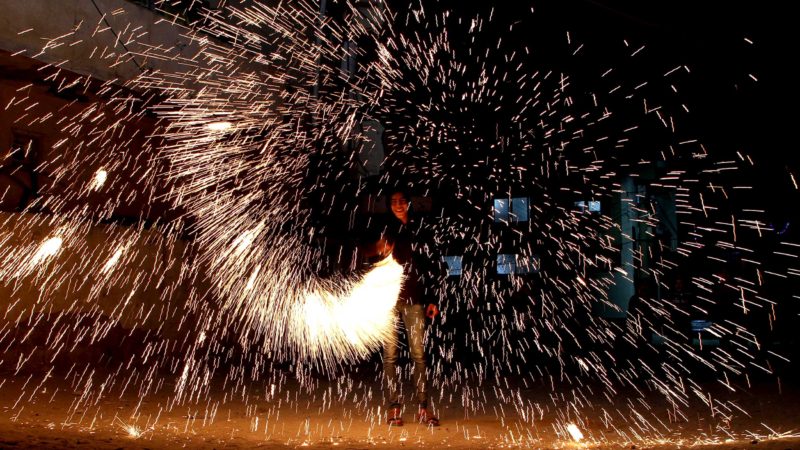 (210416) -- GAZA, April 16, 2021 (Xinhua) -- A Palestinian man plays with fireworks during the Islamic holy month of Ramadan in Gaza city, on April 16, 2021. (Photo by Rizek Abdeljawad/Xinhua)