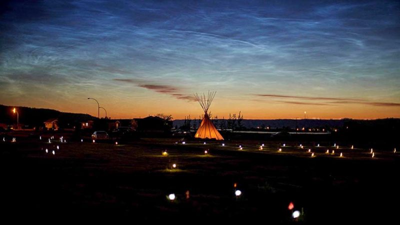 Solar lights and flags now mark the spots where 751 human remains were recently discovered in unmarked graves at the site of the former Marieval Indian Residential School on the Cowessess First Nation in Saskatchewan on June 27, 2021. - Fires on Saturday destroyed two more Catholic churches in indigenous communities in western Canada, following grim discoveries at former church-run indigenous residential schools of nearly 1,000 unmarked graves. More than 750 unmarked graves have been found near a former Catholic boarding school for indigenous children in western Canada, the second such shock discovery in less than a month. (Photo by Geoff Robins / AFP)