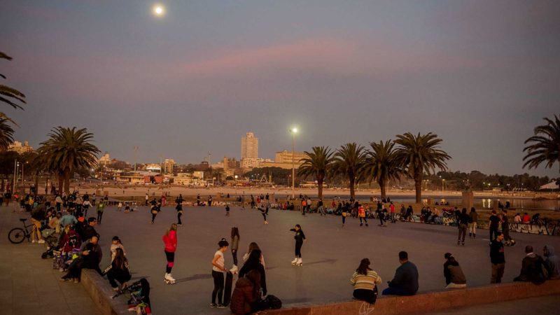 People enjoy themselves at a park, amid the new coronavirus pandemic in Montevideo, Uruguay, Thursday, July 22, 2021. Uruguay is moving into a new stage in the pandemic lockdown as more than 70% of the population has gotten at least one dose of the COVID-19 vaccine. (AP Photo/Matilde Campodonico)