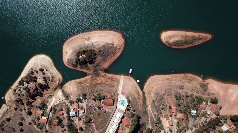 Aerial view of the Furnas Lake in Guape, Minas Gerais State, Brazil on July 19, 2021. - The Furnas Lake is at a 26,89 percent of its total capacity. The drought that hits Brazil has made electricity more expensive for its citizens. (Photo by Douglas Magno / AFP)