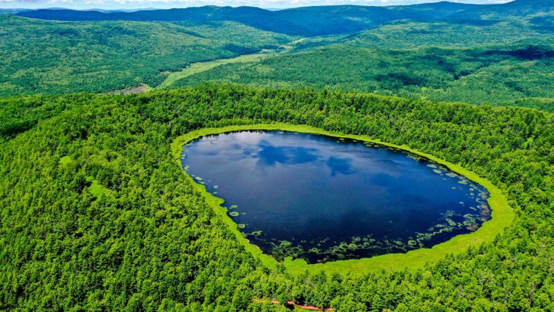 (210715) -- ARXAN, July 15, 2021 (Xinhua) -- Aerial photo taken on July 14, 2021 shows the Arxan Tianchi (Heavenly Lake) in the Arxan National Forest Park, north China's Inner Mongolia Autonomous Region. (Xinhua/Lian Zhen)