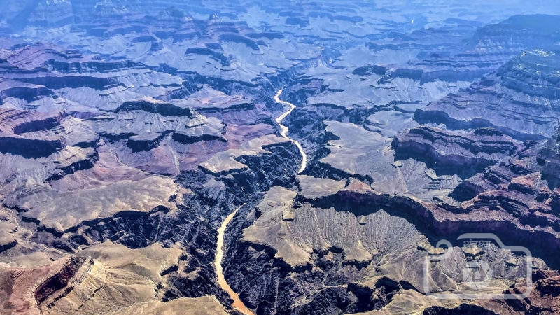 This photo provided by John Dillon shows the effects of flooding in the Colorado River through the Grand Canyon on Thursday, July 15, 2021. The river that's normally a greenish color turned a muddy brown from flash floods that have inundated Arizona. Authorities are searching for two people who were on a river rafting trip through the Grand Canyon and went missing after a flash flood, a park spokeswoman said Thursday. (Photo/RSS)