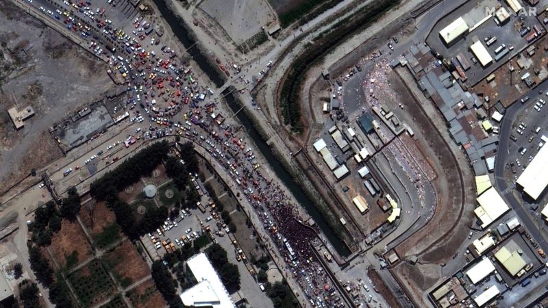 This satellite image provided by Maxar Technologies shows large crowds at the northern edge of Kabul’s international airport on Monday, Aug. 23, 2021. (Satellite Image ©2021 Maxar Technologies via AP)