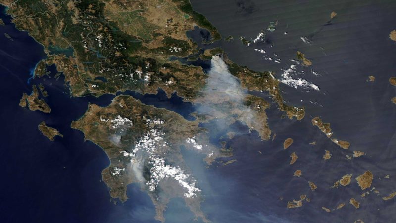 In this satellite image provided by Maxar Technologies wildfires burn north of Athens, Greece on the island of Evia, where some of the most destructive and active fires continue to burn, Sunday, Aug. 8, 2021. Pillars of billowing smoke and ash turned the sky orange and blocked out the sun above Greece's second-largest island Sunday as a days-old wildfire devoured pristine forests and encroached on villages, triggering more evacuation alerts. (Satellite image ©2021 Maxar Technologies via AP)