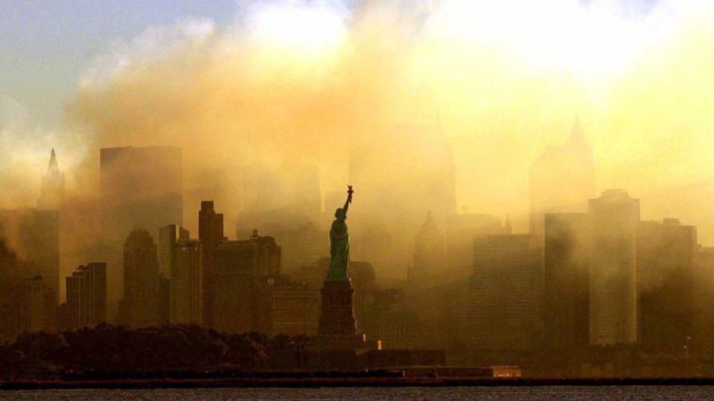 ADVANCE FOR PUBLICATION ON FRIDAY, SEPT. 10, AND THEREAFTER - FILE - In this Saturday, Sept. 15, 2001 file photo, the Statue of Liberty stands in front of a smoldering lower Manhattan at dawn, seen from Jersey City, N.J. The Sept. 11, 2001 terrorist attacks on the United States nearly 20 years ago precipitated profound changes in America and the world. (AP Photo/Dan Loh, File)