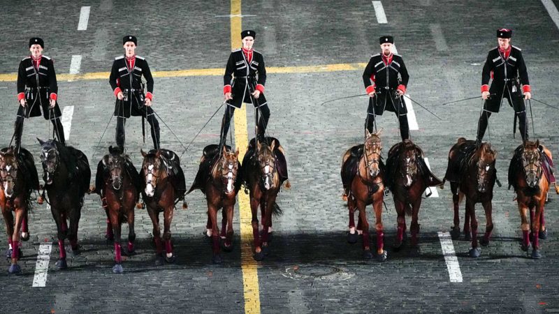 Russian soldiers ride they horses performing during the Spasskaya Tower International Military Music Festival in Red Square in Moscow, Russia, Thursday, Aug. 26, 2021. (AP Photo/Alexander Zemlianichenko)